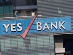 YES Bank Q1 results: The logo of Yes Bank is pictured on the facade of its headquarters in Mumbai.