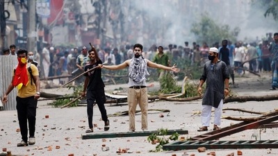 A demonstrator gestures as protesters clash with Border Guard Bangladesh (BGB) and the police outside the state-owned Bangladesh Television as violence erupts across the country after anti-quota protests by students in Dhaka. (Reuters) A demonstrator gestures as protesters clash with Border Guard Bangladesh (BGB) and the police outside the state-owned Bangladesh Television as violence erupts across the country after anti-quota protests by students in Dhaka. (Reuters)