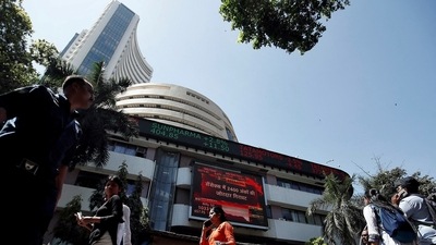 People walk past the Bombay Stock Exchange (BSE) building in Mumbai (Francis Mascarenhas/Reuters)