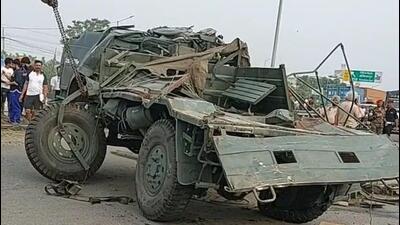 The mangled remains of the army truck being taken away after the accident on the Jalandhar-Amritsar highway on Saturday. (HT Photo)