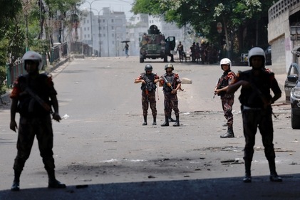 Members of Border Guard Bangladesh (BGB) stand guard outside the state-owned Bangladesh Television as violence erupts after anti-quota protests by students, in Dhaka, Bangladesh, July 19, 2024. (Reuters)