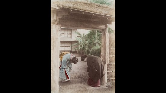 An 1880 painting of Japanese women bowing. There are several degrees of the bow, including one in which the forehead almost touches the hands. (Wikimedia)