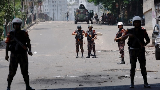 Members of Border Guard Bangladesh (BGB) stand guard outside the state-owned Bangladesh Television as violence erupts after anti-quota protests by students, in Dhaka, Bangladesh, July 19, 2024.(Reuters)