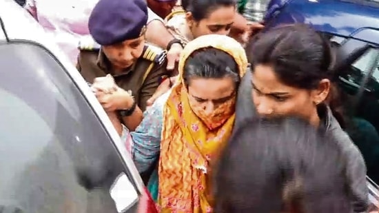 Manorama Khedkar, mother of IAS probationer Puja Khedkar, being brought by the police to a hospital for medical examination after her arrest. (HT PHOTO)