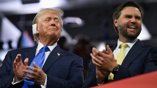 Republican presidential nominee and former US President Donald Trump (left) and Republican vice-presidential nominee JD Vance applaud on Day 2 of the Republican National Convention, in Milwaukee, Wisconsin, on Tuesday. (Reuters)