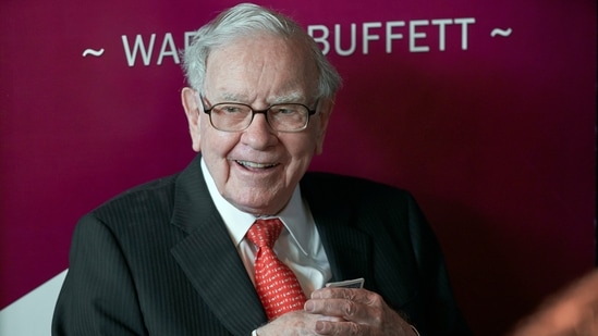 Warren Buffett, chairman and CEO of Berkshire Hathaway, smiles as he plays bridge following the annual Berkshire Hathaway shareholders meeting in Omaha.(AP)