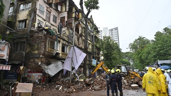 Fire brigade official rescued the resident of Rubinissa manzil after the balcony portion collapsed at Grant road in Mumbai (HT photo by Anshuman Poyrekar)