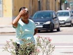 A woman looks on during a heatwave in Valencia, Spain July 20, 2024. REUTERS/Eva Manez
