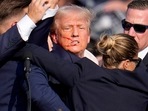 Republican presidential candidate former President Donald Trump is helped off the stage by U.S. Secret Service agents at a campaign event in Butler, Pa., on Saturday, July 13, 2024. (AP Photo/Gene J. Puskar) Republican presidential candidate former President Donald Trump is helped off the stage by U.S. Secret Service agents at a campaign event in Butler, Pa., on Saturday, July 13, 2024. (AP Photo/Gene J. Puskar)