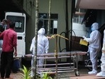 Health workers shifted people who have been in contact with a person infected with the Nipah virus to an isolation centre at a government hospital in Kozhikode in September 2023.(AFP) Health workers shifted people who have been in contact with a person infected with the Nipah virus to an isolation centre at a government hospital in Kozhikode in September 2023.(AFP)