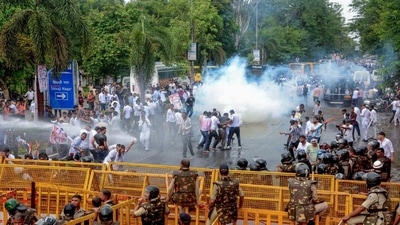 Bhopal, Jul 15 (ANI): Police use tear gas and water cannons to disperse the National Students' Union of India (NSUI) activists during their demonstration against the alleged paper leak of NEET-UG exam, nursing scam and Agnipath scheme, near CM's residence in Bhopal on Monday. (ANI Photo) (Sanjeev Gupta) Bhopal, Jul 15 (ANI): Police use tear gas and water cannons to disperse the National Students' Union of India (NSUI) activists during their demonstration against the alleged paper leak of NEET-UG exam, nursing scam and Agnipath scheme, near CM's residence in Bhopal on Monday. (ANI Photo) (Sanjeev Gupta)