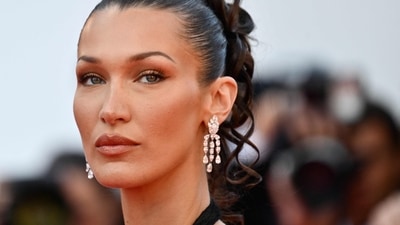 (FILES) US model Bella Hadid arrives for the screening of the film "L'Amour Ouf" (Beating Hearts) at the 77th edition of the Cannes Film Festival in Cannes, southern France, on May 23, 2024. Adidas said on July 19, 2024, it had dropped vocal pro-Palestinian model Bella Hadid from an advertising campaign for retro sneakers referencing the 1972 Munich Olympics, which were overshadowed by a massacre of Israeli athletes. (AFP / Christophe SIMON) (FILES) US model Bella Hadid arrives for the screening of the film "L'Amour Ouf" (Beating Hearts) at the 77th edition of the Cannes Film Festival in Cannes, southern France, on May 23, 2024. Adidas said on July 19, 2024, it had dropped vocal pro-Palestinian model Bella Hadid from an advertising campaign for retro sneakers referencing the 1972 Munich Olympics, which were overshadowed by a massacre of Israeli athletes. (AFP / Christophe SIMON)