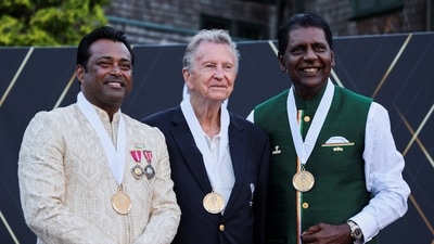 Leander Paes, Richard Evans and Vijay Amritraj pose for a photo after getting inducted into the International Tennis Hall of Fame in Newport. (REUTERS)