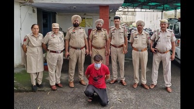 The police on Sunday arrested a man for scattering threatening pamphlets on Daki Road in Balaji Nagar in Pathankot .