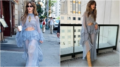 Daisy Edgar-Jones is Hollywood's latest It-girl, and her sartorial experiments are proof. In this look, she wore an ice-blue sheer blouse with trumpet sleeves and a midriff-baring hem. She styled it with a matching sheer ruffle skirt, thigh-high boots, a statement neckpiece, earrings, sunglasses, and loose tresses. (Instagram) Daisy Edgar-Jones is Hollywood's latest It-girl, and her sartorial experiments are proof. In this look, she wore an ice-blue sheer blouse with trumpet sleeves and a midriff-baring hem. She styled it with a matching sheer ruffle skirt, thigh-high boots, a statement neckpiece, earrings, sunglasses, and loose tresses. (Instagram)