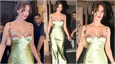 Disha Patani wore a green maxi dress to her dinner date last night. She styled the floral embroidered ensemble with a messy bun, berry-toned lips, a mini handbag, a dainty gold chain, and stacked bracelets. (Instagram) Disha Patani wore a green maxi dress to her dinner date last night. She styled the floral embroidered ensemble with a messy bun, berry-toned lips, a mini handbag, a dainty gold chain, and stacked bracelets. (Instagram)