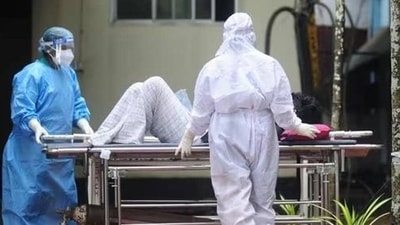 Health workers shift a man with symptoms of Nipah virus to an isolation ward at a government hospital in Kerala. (AFP / File) Health workers shift a man with symptoms of Nipah virus to an isolation ward at a government hospital in Kerala. (AFP / File)