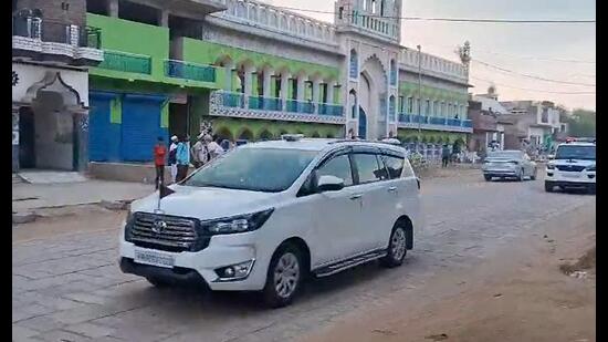 A police vehicle during a flag march on the eve of Brij Mandal Jal Abhishek Yatra in Nuh on Sunday. (PTI)