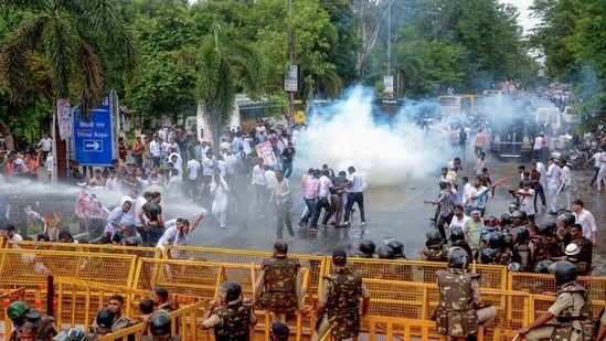 Bhopal, Jul 15 (ANI): Police use tear gas and water cannons to disperse the National Students' Union of India (NSUI) activists during their demonstration against the alleged paper leak of NEET-UG exam, nursing scam and Agnipath scheme, near CM's residence in Bhopal on Monday. (ANI Photo) (Sanjeev Gupta)