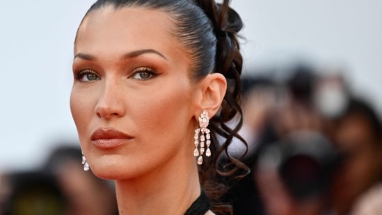 (FILES) US model Bella Hadid arrives for the screening of the film "L'Amour Ouf" (Beating Hearts) at the 77th edition of the Cannes Film Festival in Cannes, southern France, on May 23, 2024. Adidas said on July 19, 2024, it had dropped vocal pro-Palestinian model Bella Hadid from an advertising campaign for retro sneakers referencing the 1972 Munich Olympics, which were overshadowed by a massacre of Israeli athletes. (AFP / Christophe SIMON)