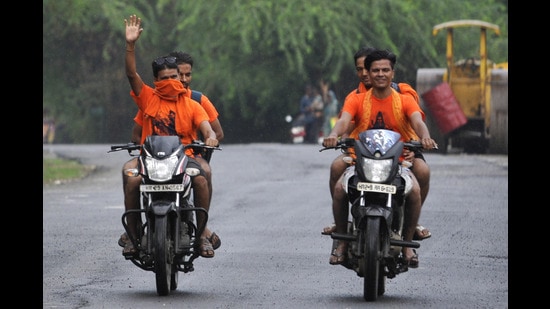 Kanwariyas exempted from the ‘No helmet, No fuel rule’ ride a motorbike on July 26, 2019 (HT File)