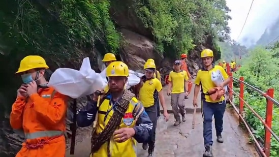 SDRF personnel conduct a rescue operation following a landslide on the Kedarnath trekking route, in Rudraprayag district, Sunday, July 21, 2024.(PTI)