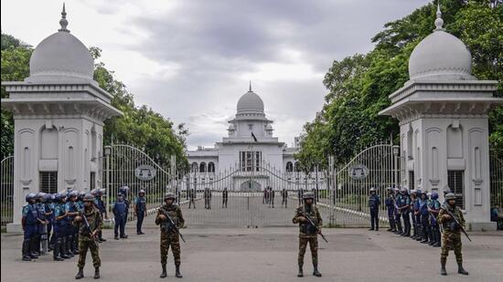 Police stand guard outside Bangladesh's Supreme Court in Dhaka, Bangladesh, Sunday. Bangladesh top court on Sunday scaled back a controversial quota system for government job applicants. (AP)