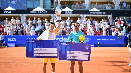 Portugal's Nuno Borges (L) and Spain's Rafael Nadal celebrate after their men's final singles match of the ATP Nordea Open tennis tournament in Bastad, Sweden.(AFP)