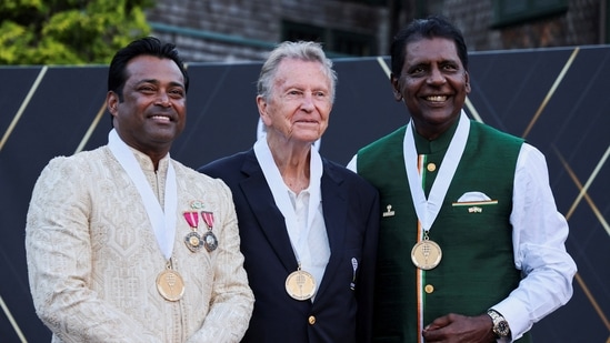 Leander Paes, Richard Evans and Vijay Amritraj pose for a photo after getting inducted into the International Tennis Hall of Fame in Newport.(REUTERS)