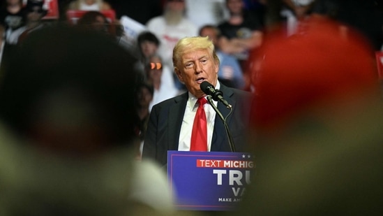 TOPSHOT - Former US President and 2024 presidential nominee Donald Trump speaks during a campaign rally with US Senator and vice presidential nominee J.D. Vance at Van Andel Arena in Grand Rapids, Michigan, on July 20, 2024. (Photo by Jim WATSON / AFP)(AFP)