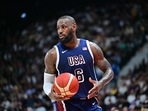 (FILES) USA's forward #06 LeBron James looks on during the Basketball Showcase friendly match between the United States and Australia at Etihad Arena in Abu Dhabi on July 15, 2024. LeBron James, the NBA's all-time leading points scorer, will be the male flagbearer for Team USA at the Paris Olympics, the USOPC announced on July 22, 2024. (AFP / Giuseppe CACACE) (FILES) USA's forward #06 LeBron James looks on during the Basketball Showcase friendly match between the United States and Australia at Etihad Arena in Abu Dhabi on July 15, 2024. LeBron James, the NBA's all-time leading points scorer, will be the male flagbearer for Team USA at the Paris Olympics, the USOPC announced on July 22, 2024. (AFP / Giuseppe CACACE)