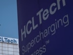FILE PHOTO: A pigeon flies past a logo of HCL Technologies installed at their headquarters in Noida, on the outskirts of New Delhi, India, August 28, 2023. REUTERS/Adnan Abidi/File Photo