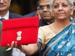 India's Finance Minister Nirmala Sitharaman holds up a folder with the Government of India's logo as she leaves her office to present the federal budget in the parliament, ahead of the nation's general election, in New Delhi, India, February 1, 2024. REUTERS/Anushree Fadnavis/File Photo/File Photo