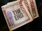 Assistant Shift Foreman Howard Fewell holds copies of the New York Post front page the day U.S. President Joe Biden announced that he is dropping his reelection bid, at the New York Times College 