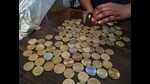 Navi Mumbai: A shopkeeper counts coins at his store, ahead of the presentation of the Union Budget 2024-25 by Union Finance Minister Nirmala Sitharaman, in Navi Mumbai, Monday, July 22, 2024. (PTI Photo)(PTI07_22_2024_000179A) (PTI)