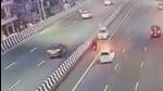 The video shows a scooter moving towards Ghaziabad in the extreme right lane while a white car is seen approaching it from the wrong side, crashing into the scooter head-on within seconds. (HT Photo) The video shows a scooter moving towards Ghaziabad in the extreme right lane while a white car is seen approaching it from the wrong side, crashing into the scooter head-on within seconds. (HT Photo)