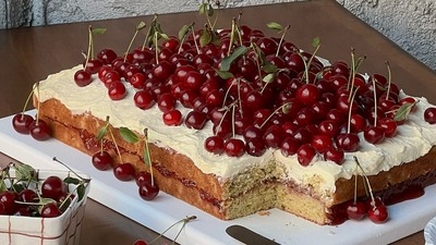 A vanilla sheet cake with buttercream and topped with cherries (Instagram) A vanilla sheet cake with buttercream and topped with cherries (Instagram)
