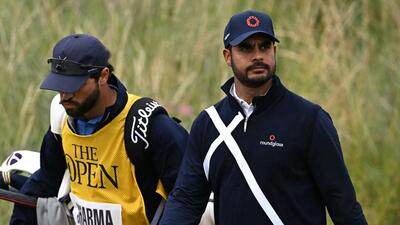 India's Shubhankar Sharma (R) and his caddie Lyle Phillips during the final round of the British Open Golf Championship. (AFP) India's Shubhankar Sharma (R) and his caddie Lyle Phillips during the final round of the British Open Golf Championship. (AFP)