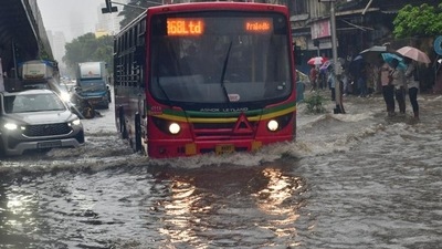 Mumbai, India – July 21, 2024: Vechiles way through the waterlogged on the road during monsoon rain, at Parel, in Mumbai, India, on Sunday, July 21, 2024. (Photo by Bhushan Koyande/HT Photo) Mumbai, India – July 21, 2024: Vechiles way through the waterlogged on the road during monsoon rain, at Parel, in Mumbai, India, on Sunday, July 21, 2024. (Photo by Bhushan Koyande/HT Photo)