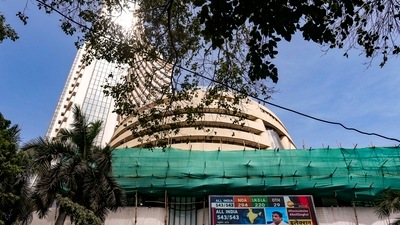 A screen displays stock numbers outside the Bombay Stock Exchange (BSE) building in Mumbai. (PTI) A screen displays stock numbers outside the Bombay Stock Exchange (BSE) building in Mumbai. (PTI)