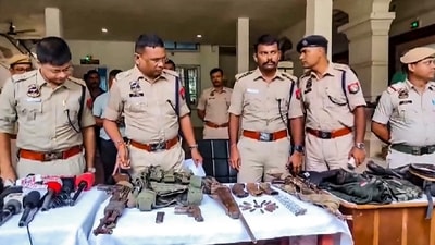 Cachar: Police personnel display the arms and ammunition recovered after an encounter with alleged Hmar terrorists, in Cachar district of Assam, Wednesday, July 17, 2024. (PTI Photo) (PTI)