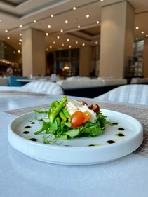 A salad of grilled nectarine and arugula salad with asparagus, ricotta cheese and pickled shallots by The Leela Bhartiya City Bengaluru A salad of grilled nectarine and arugula salad with asparagus, ricotta cheese and pickled shallots by The Leela Bhartiya City Bengaluru