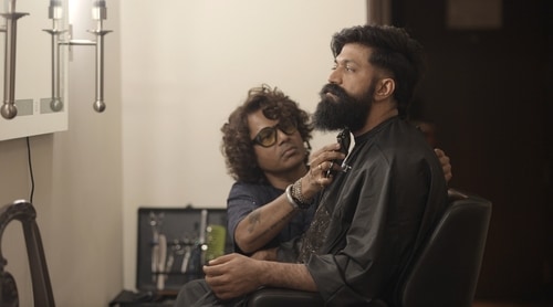Celebrity hairstylist Alex Vijaykanth with actor Yash Celebrity hairstylist Alex Vijaykanth with actor Yash