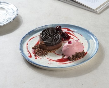 Cocoa ganache with sour cherry ice cream and phalsa compote at Sly Granny