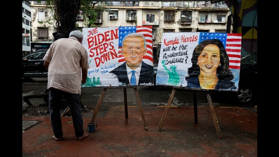 An art school teacher paints pictures of U.S President Joe Biden and U.S Vice President Kamala Harris after Biden announced that he was dropping his re-election bid, on a street in Mumbai, India, July 22, 2024. REUTERS/Francis Mascarenhas (REUTERS)