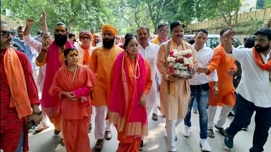 Devotees on their way to Nalhar Mahadev temple for Jal Abhishek at Nuh, Gurugram on Monday. (HT Photo)