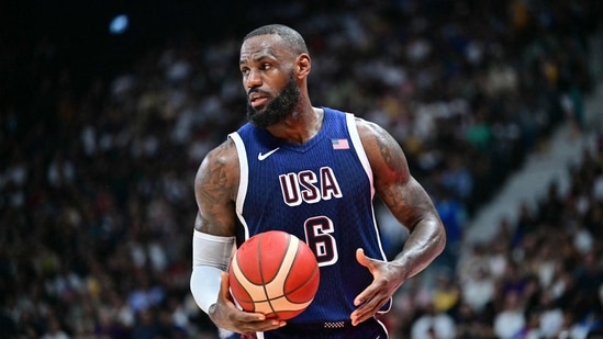 (FILES) USA's forward #06 LeBron James looks on during the Basketball Showcase friendly match between the United States and Australia at Etihad Arena in Abu Dhabi on July 15, 2024. LeBron James, the NBA's all-time leading points scorer, will be the male flagbearer for Team USA at the Paris Olympics, the USOPC announced on July 22, 2024. (AFP / Giuseppe CACACE)