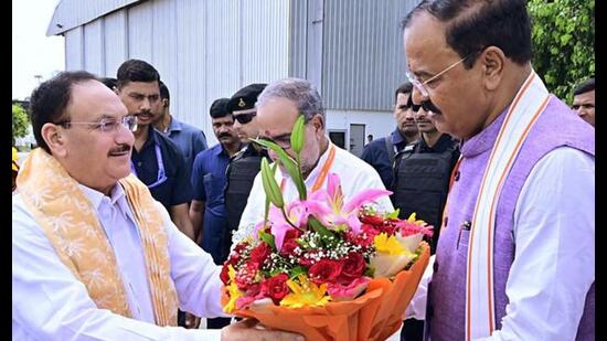 JP Nadda receives a warm welcome from UP deputy chief minister Keshav Prasad Maurya on his arrival at Amausi Airport, in Lucknow recently. (ANI Photo)