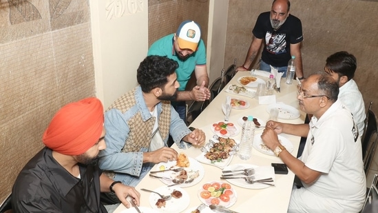 Vicky Kaushal, Ammy Virk savouring kabab-paratha at Tundey Kababi in Lucknow(HT Photo)