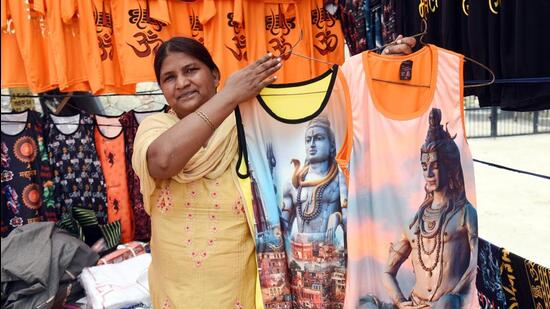 Saffron flags and T Shirts on sale on Delhi Meerut Road during the kanwar yatra in Ghaziabad. (Sakib Ali/HT Photo)